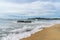 Tropical beach with palm trees. cloudy sky