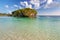 Tropical beach with a rock in the water, Isle of Pines