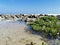 Tropical beach with rocks and small bushes