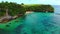 Tropical beach and rocks with turquoise ocean. Aerial view of paradise place in Bali