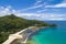 Tropical beach with sea and palm taken from drone. Beach and sea photo. Romantic beach aerial view