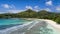 Tropical beach with sea and palm taken from drone. Beach and sea photo. Romantic beach aerial view