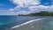 Tropical beach with sea and palm taken from drone. Beach and sea photo. Romantic beach aerial view