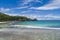 Tropical beach with sea and palm taken from drone. Beach and sea photo. Romantic beach aerial view