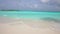 Tropical beach in slow motion. Amazing Sandy coastline with white turquiose sea waves. Beautiful view of white sand