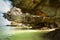 Tropical beach view from karst limestone cave. Ocean landscape u