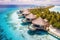 Tropical beach with water bungalows at Maldives, Perfect aerial landscape, luxury tropical resort or hotel with water villas and