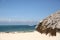 Tropical beach with white sand, blu sea, blu sky and sailboats