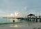 Tropical beach with wooden pier