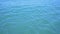 Tropical blue sea water with small waves and reflections