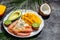 tropical bowl with avocado, prawns, rice, mango, kiwi and coconut, tropical food on the sea beach, Organic and healthy food, place