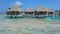 Tropical bungalows with thatched roof over the sea