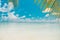 Tropical conceptual beach banner. Tropical nature scene. Palm trees and blue sky. Summer holiday and vacation concept.