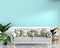 Tropical design,armchair,plant,cabinet on granite floor and mint background.3 d rendering