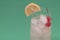 Tropical drink with vodka cherry and lemon slice for a delicious Tom Collins