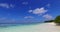 Tropical flying island view of a white paradise beach and blue sea background in vibrant 4K