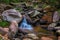 Tropical forest with smooth stream waterfall