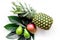 Tropical fruits background. Mango near exotic leaf and pineapple on white top view