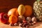 Tropical fruits and nuts vegan diet. Pineapple, grapefruit, orange, pear, walnuts on wooden background,weight loss foods