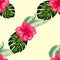 Tropical hibiscus flowers and palm leaves bouquets seamless pattern