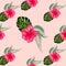 Tropical hibiscus flowers and palm leaves bouquets seamless pattern