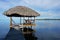 Tropical hut palapa over the water