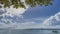 Tropical idyll. Yachts and boats are visible in the calm turquoise ocean.