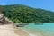 Tropical island beach and clear blue lagoon water with blue sky at kho Surin Island, Phang Nga Province, South of Thailand