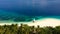 Tropical island with a beach and palm trees. Mahaba Island, Philippines.