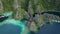 Tropical island with boats in lagoons