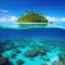 Tropical Island And Coral Reef Split View With Beautiful underwater view of lone small island above and below the water