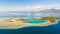 Tropical island with mangroves and turquoise lagoons on a coral reef, top view.Fraser Island, seascape Honda Bay