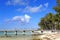 The tropical island, palm trees, the bridge going to the sea