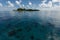 Tropical island rises above coral reef in Hol Chan Marine Reserve Belize