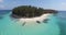 Tropical Island view of nice beach with boats and small wave