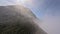 Tropical island volcano smoke panorama stone crater with mist gas steam sea landscape aerial view