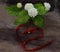 Tropical jasmine flower and Bell red Bow on wood. Jasmine flowers