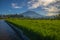 Tropical landscape during sunrise. Scenic view to Agung Volcano. River and rice fields in the village. Bali, Indonesia