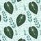 Tropical leaves seamless pattern on green background