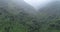 tropical mountains in foggy summer morning