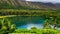 Tropical Oasis: Serene Lake and Palms in Hawaii