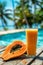 Tropical Papaya lassi and fresh papaya fruit near poolside