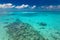 Tropical paradise beach. Caucasian couple of tourists snorkel in crystal turquoise water near Maldives Islan