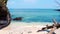 Tropical paradise beach with white sand and fallen tree. travel tourism wide panorama background concept