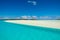 Tropical paradise in clear turquoise water, white sandbar, small islands with palms, South Pacific Island, Aitutaki, Cook Islands
