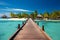 Tropical paradise Luxury travel backdrop with a wooden pier panorama