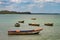 Tropical paradise typical scenery: colored wooden boats docked in the sea. Miches Bay or Sabana De La Mar lagoon, northern