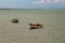 Tropical paradise typical scenery: colored wooden boats docked in the sea. Miches Bay or Sabana De La Mar lagoon, northern