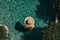 Tropical Pool Paradise: Aerial Photo of Woman in Hat Enjoying Summer