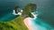 Tropical pristine sandy beach and green forest on ocean coastline with azure ocean waves. Nusa Penida, Kelingking beach